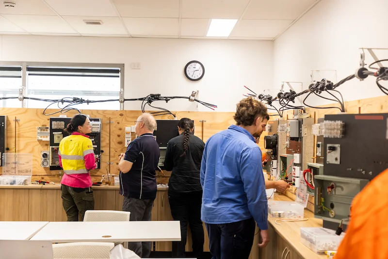 NECA Trainers Guiding Apprentices in a Collaborative Electrical Training Environment